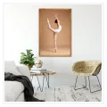 Ballerina In Graceful Pose Beige Background Canvas Print
