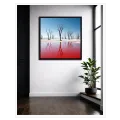 Bare Desert Trees With Vibrant Red Lake Reflection