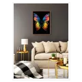 Vibrant Rainbow Butterfly on Black Background Canvas Art