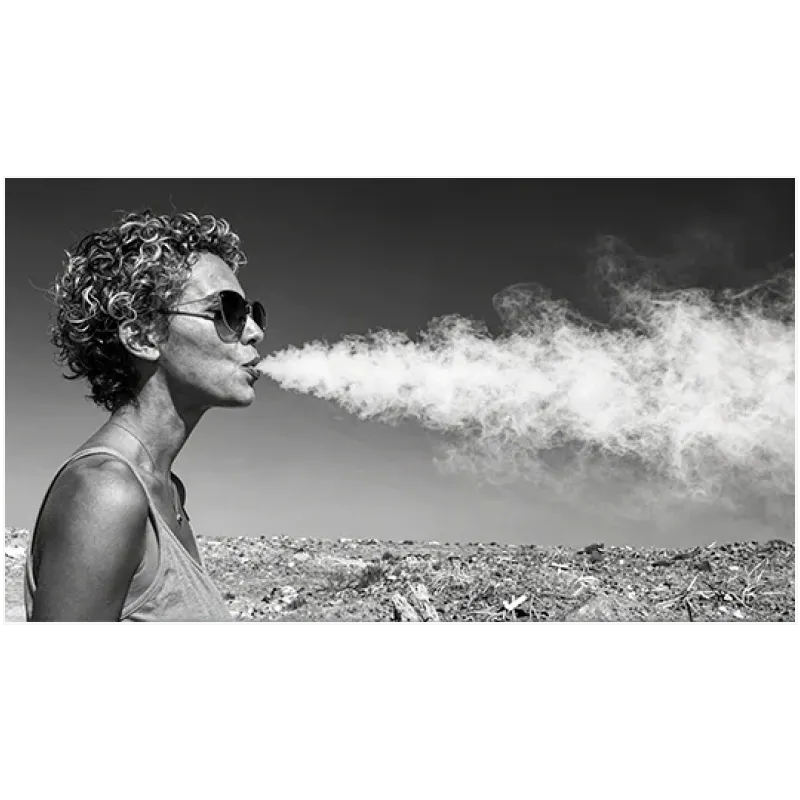 Woman with Sunglasses blowing Smoke Black and White Portrait
